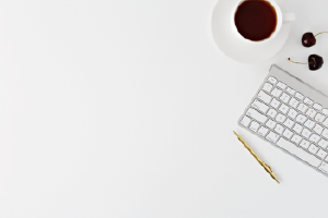 Desk with coffee cup and keyboard